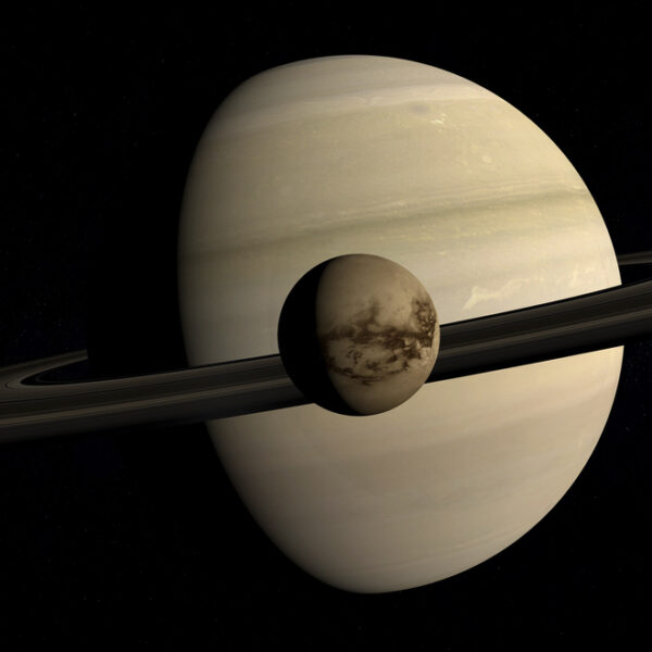 Titan in front of Saturn - Deposit Photos